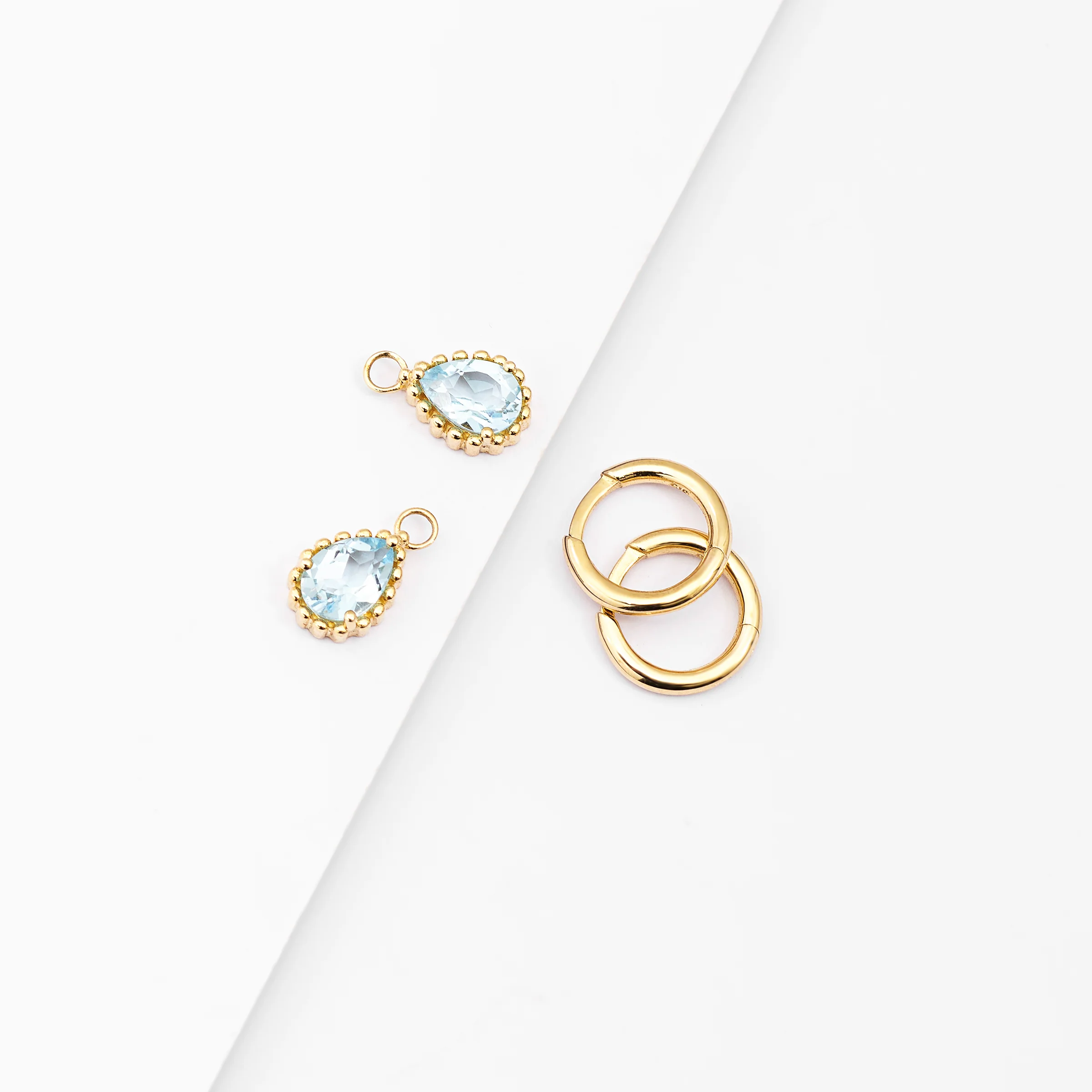 9K Yellow Gold Huggie Earrings With Dangling Blue Topaz Pear - Image 2