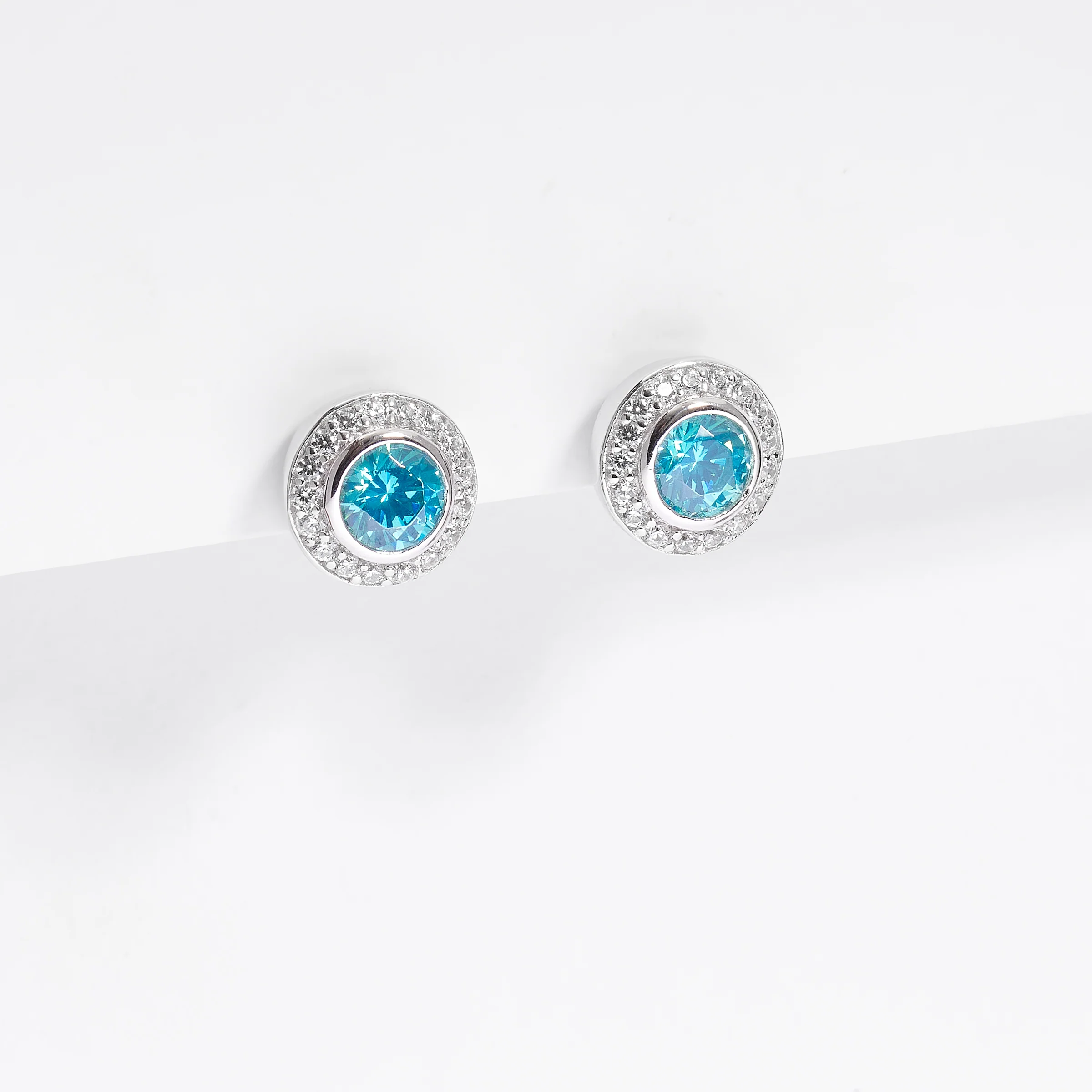 Sterling Silver Bezel Aqua Green Zirconia And Halo Stud Earrings - Image 2